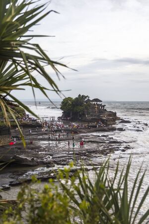 BALI, INDONESIA - JANUARY 26, 2019: Unidentified people by Tanah Lot temple at Bali, Indonesia. It is ancient Hindu pilgrimage temple and one of Baliâs most important landmarks.のeditorial素材