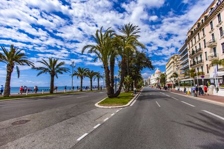 NICE, FRANCE - MAY 1, 2019: Unidentified people on the Promenade de Anglais in Nice, France. From the 19th century, English chose it as their favourite winter holiday destination and gave name to the most famous promenade in the world.のeditorial素材