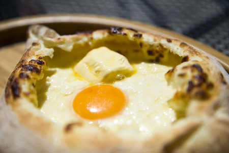 Closeup detail of the traditional Georgian adjarian khachapuri cheese breadの写真素材