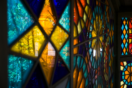 Closeup detail of the colorful stained glass windowの写真素材
