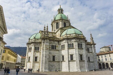 COMO, ITALY - APRIL 16, 2019: Unidentified people by Como Cathedral (Duomo di Como) in Como, Italy. It is is Roman Catholic cathedral opened at 1396.のeditorial素材