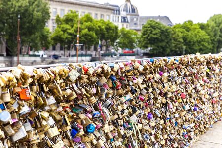 PARIS, FRANCE - JUNE 12,  2017: Love padlockas at Pont Neuf in Paris, France. During April 2018 at least 40 tons of love padlocks have been removed from the Pont Neuf after safety concerns were raised.のeditorial素材