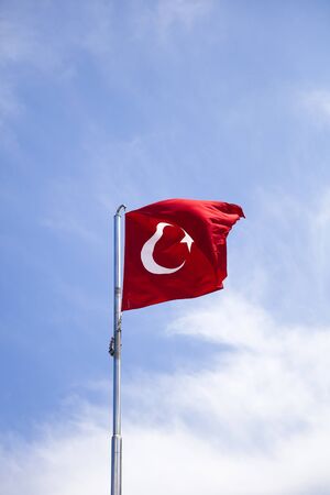 View at Turkish flag waving in the wind at blue sky