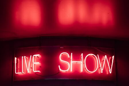 Vintage neon live show sign on the wallの写真素材