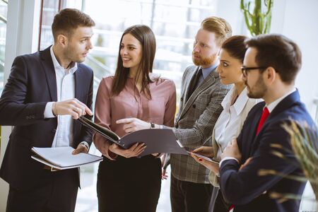 Group of successful business people standing in the office