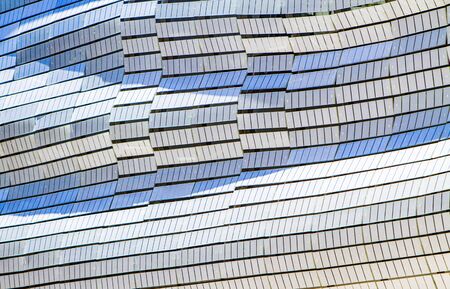 Wavy glass front of a modern office building