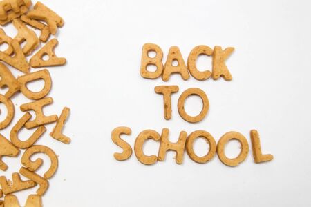 Alphabet cake letters with text Back to school, isolated on the white backgroundの写真素材