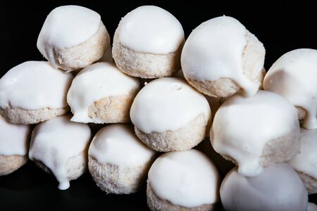 Small round coconut biscuits on the dark background