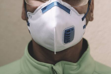 Man wearing a protective mask at the time of pandemic deseaseの写真素材