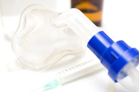 Medical equipment for inhalation with respiratory mask, nebulizer on the white tableの写真素材