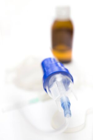 Medical equipment for inhalation with respiratory mask, nebulizer on the white tableの写真素材