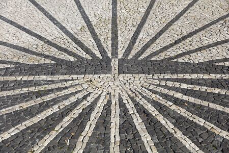 Closeup surface of the blocky pattern old stone pavementの写真素材
