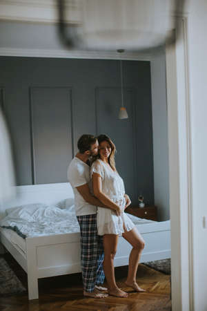 View at loving young couple huging  in the roomの写真素材