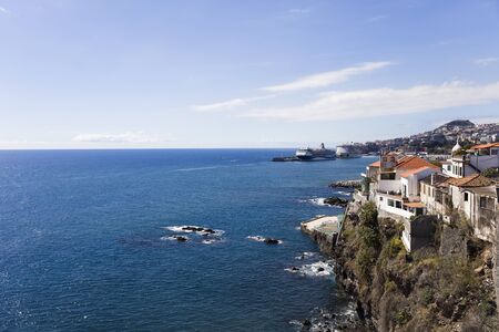 Distant view at cruise ships in the port of Funchal at Madeira island, Portugalの写真素材