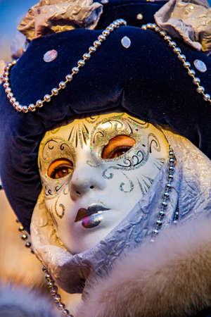 VENICE, ITALY - FEBRUARY 9, 2013: Unidentified person with Venetian carnival mask in Venice, Italy. At 2013 it is held from January 26th to February 12th.のeditorial素材