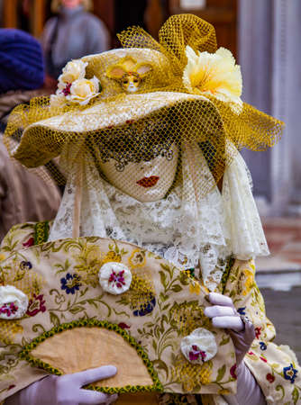 VENICE, ITALY - FEBRUARY 9, 2013: Unidentified person with Venetian carnival mask in Venice, Italy. At 2013 it is held from January 26th to February 12th.のeditorial素材