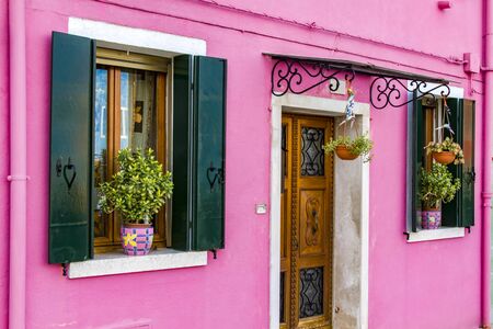 View at traditional brightly colored house on Burano island, Italyの写真素材