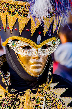 VENICE, ITALY - FEBRUARY 9, 2013: Unidentified person with Venetian carnival mask in Venice, Italy. At 2013 it is held from January 26th to February 12th.のeditorial素材