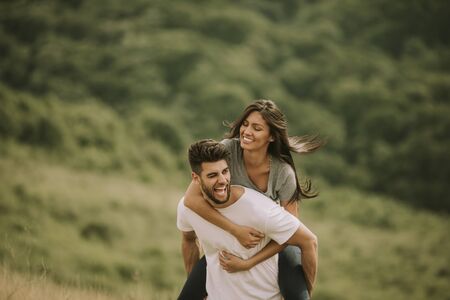 Pretty young couple in love outside in the spring natureの写真素材