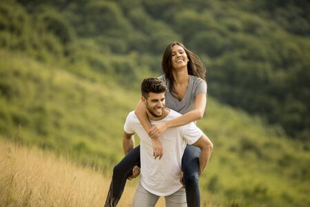 Pretty young couple in love outside in the spring natureの写真素材