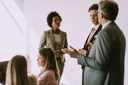 Group of multiethnic business people working on new project in the modern officeの写真素材
