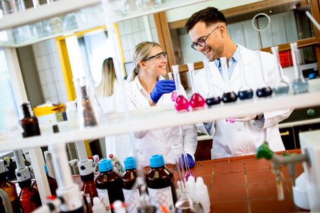 Young researchers analyzing chemical data in the laboratoryの写真素材