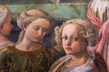 FLORENCE, ITALY - APRIL 7, 2018: Detail from The Coronation of the Virgin by Filippo Lippi (1447)...