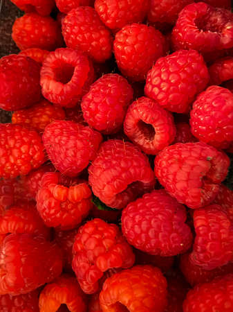 Closeup view at a pile of fresh raspberries