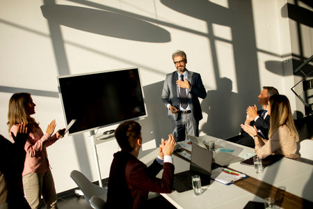 View at group of business people working together and preparing new project on a meeting in the officeの写真素材