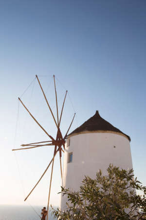 View at traditional windmill in Oia on Santorini island, Greece