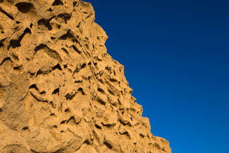 Closeup view at Vlychada beach volcanic ash sand rock formation on Santorini island in Greeceの写真素材