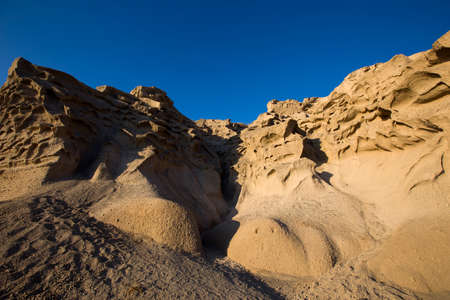 View at Vlychada beach volcanic ash sand rock formation on Santorini island in Greece
