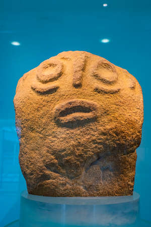 BOLJETIN, SERBIA - SEPTEMBER 3, 2021: Red sandstone prehistoric figurine from Museum of Lepenski Vir in Serbia. It is important archaeological site of the Mesolithic Iron Gates culture of the Balkans.のeditorial素材