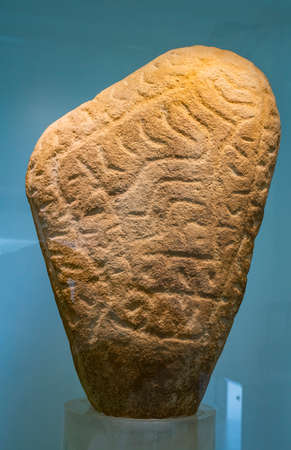 BOLJETIN, SERBIA - SEPTEMBER 3, 2021: Red sandstone prehistoric figurine from Museum of Lepenski Vir in Serbia. It is important archaeological site of the Mesolithic Iron Gates culture of the Balkans.のeditorial素材