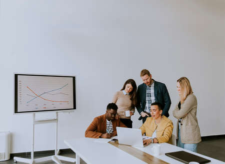 Group of young multiethnic business people working together and preparing new project on a meeting in the officeの写真素材