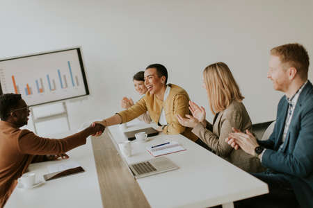 Group of young multiethnic business people working together and preparing new project on a meeting in the officeの写真素材