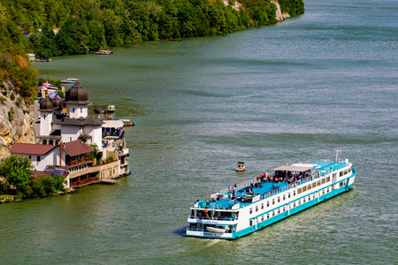 Djerdap, Serbia - September 2, 2021: Cruise ship on river Danube in Djerdap gorge in Serbia. At 2016 118 cruise ships with more than 18.000 tourists visited Djerdap National Park.のeditorial素材