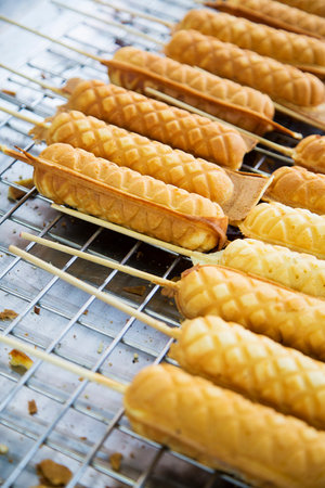 Detail of the Thai street food hot dog waffle sticks in Bangkokの写真素材