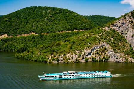 Danube, Serbia - July 1, 2022: Der kleine Prinz (The Little Prince) river cruise ship in Danube Gorge in Serbia. Ship was built in 1990s, accomodate 90 passengers and sailing under the flag of Germany.のeditorial素材