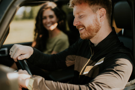 Young handsome couple having fun on roadtripの写真素材