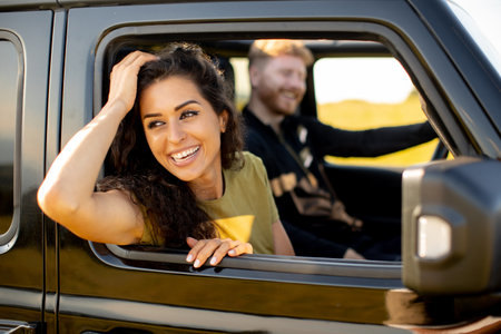 Young handsome couple having fun on roadtrip