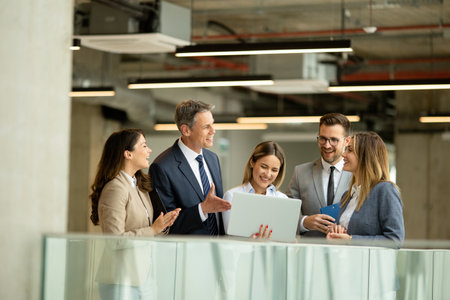 Young startup team working in the modern office corridor