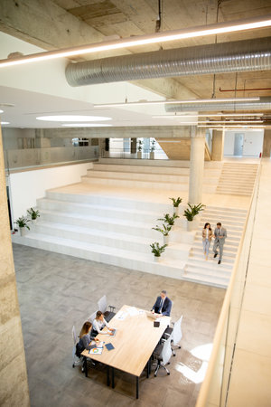 Aerial view young startup team working in the modern officeの写真素材