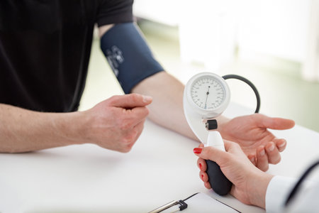 A medical expert focuses on writing down vital information in a clinical setting.の写真素材