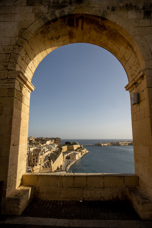 Spectacular landscape reveals the stunning Grand Harbour reflecting the calm waters of Valletta. A peaceful moment in a beautiful setting.の写真素材