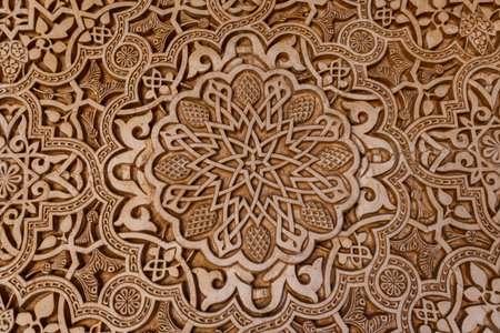 Delicate carvings adorn the walls of Alhambra, showcasing stunning artistry steeped in Spanish culture and rich history from centuries ago.の写真素材
