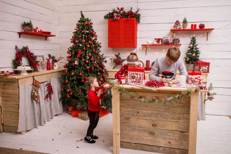 children write letters to Santa Claus in the New Year's kitchenの写真素材