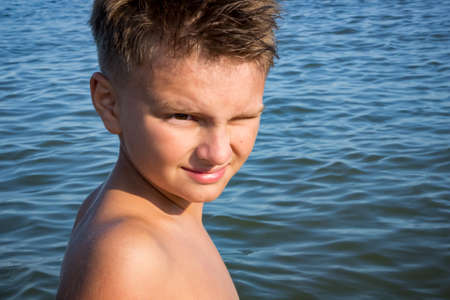 young boy in the summer at sea, schoolboyの写真素材
