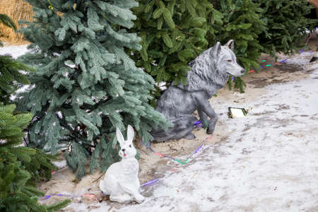 decorative hare and in the winter park under the trees