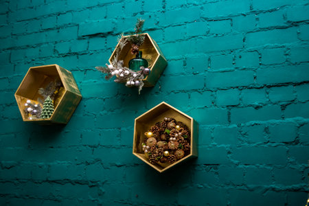 New Year's decorations - layers, cones, branches on original shelves on a green brick wall, decorations,の写真素材